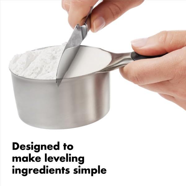 OXO measuring cup in use leveling flour for accurate ingredient portioning
