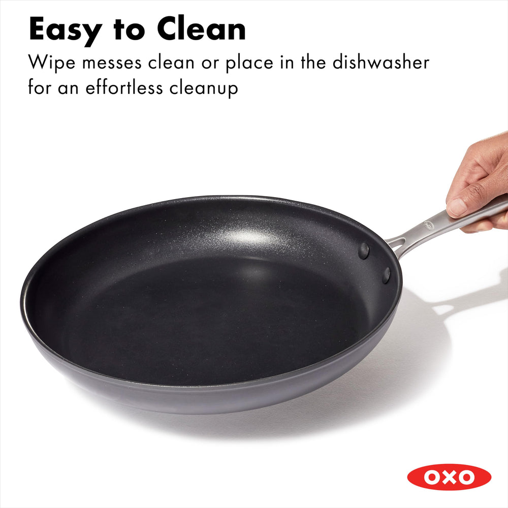 OXO pan on stovetop with vegetables demonstrating reliable searing and quick cleanup benefit