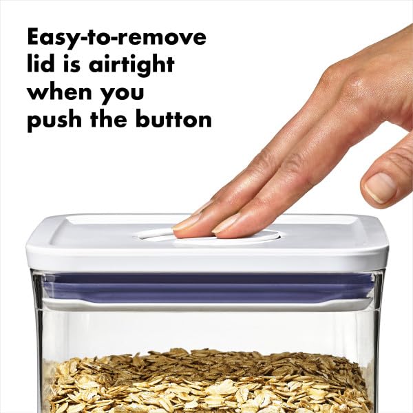 Hand pouring cereal from OXO container for smooth dispensing and controlled serving