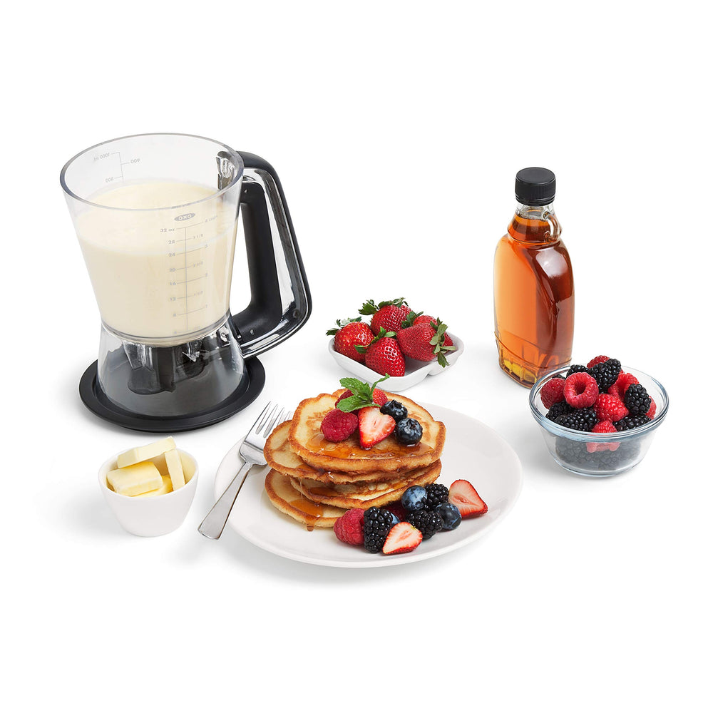 OXO Good Grips dispensing batter into cupcake tin for neat, uniform cups