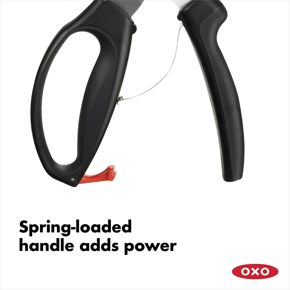 OXO shears cutting a chicken joint in a kitchen scene, illustrating efficient poultry portioning