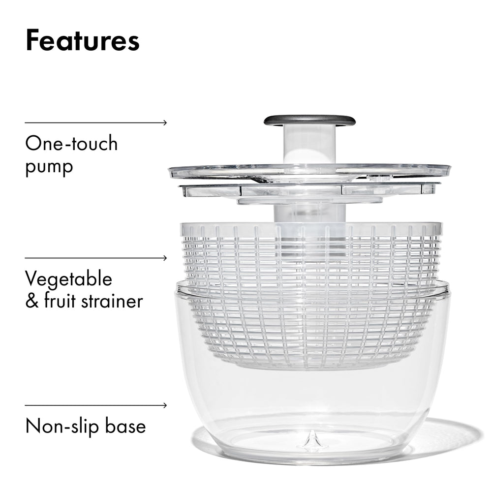 OXO spinner in use rinsing lettuce under faucet, speeds vegetable washing