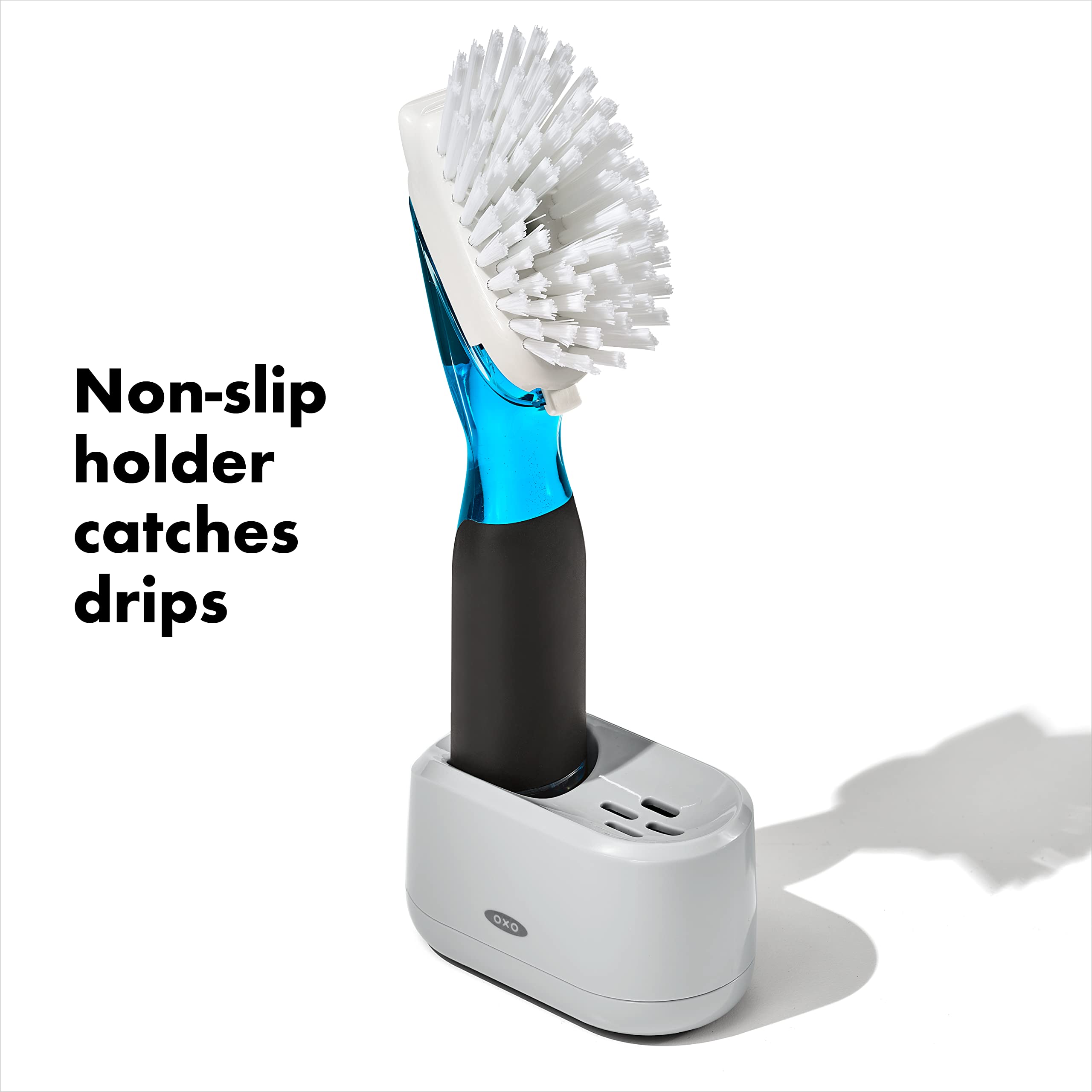 OXO storage stand holding brush upright to ventilate and keep counters organized