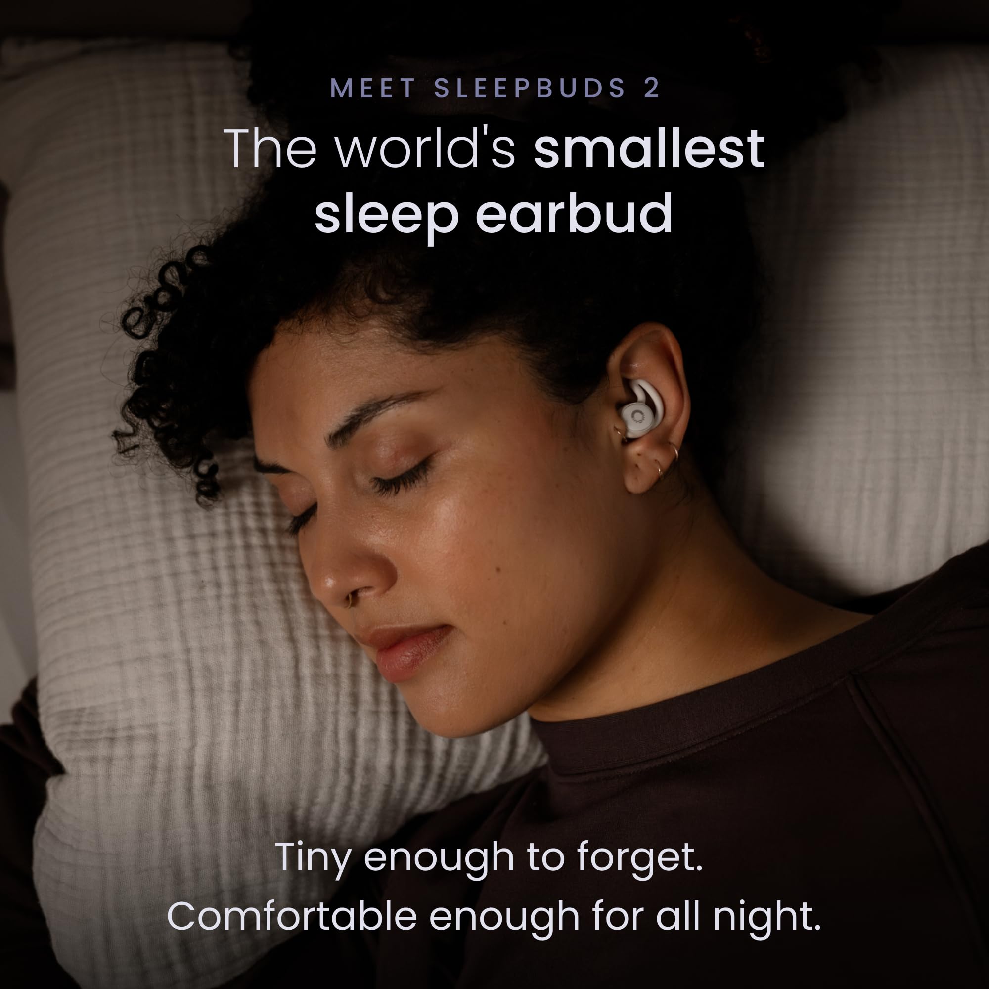 Ozlo earbud close-up highlighting tiny form factor and soft tip comfort