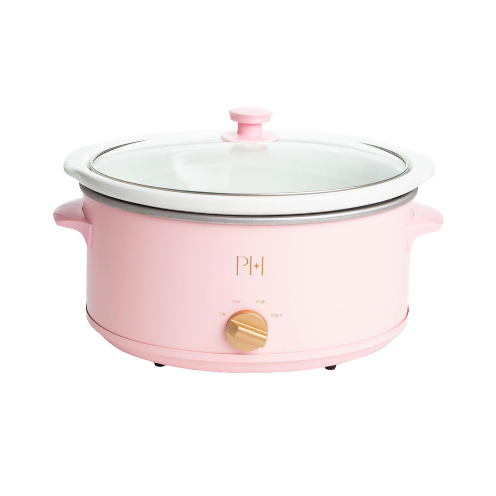Paris Hilton slow cooker front view showing pink exterior and gold accents, stylish countertop benefit
