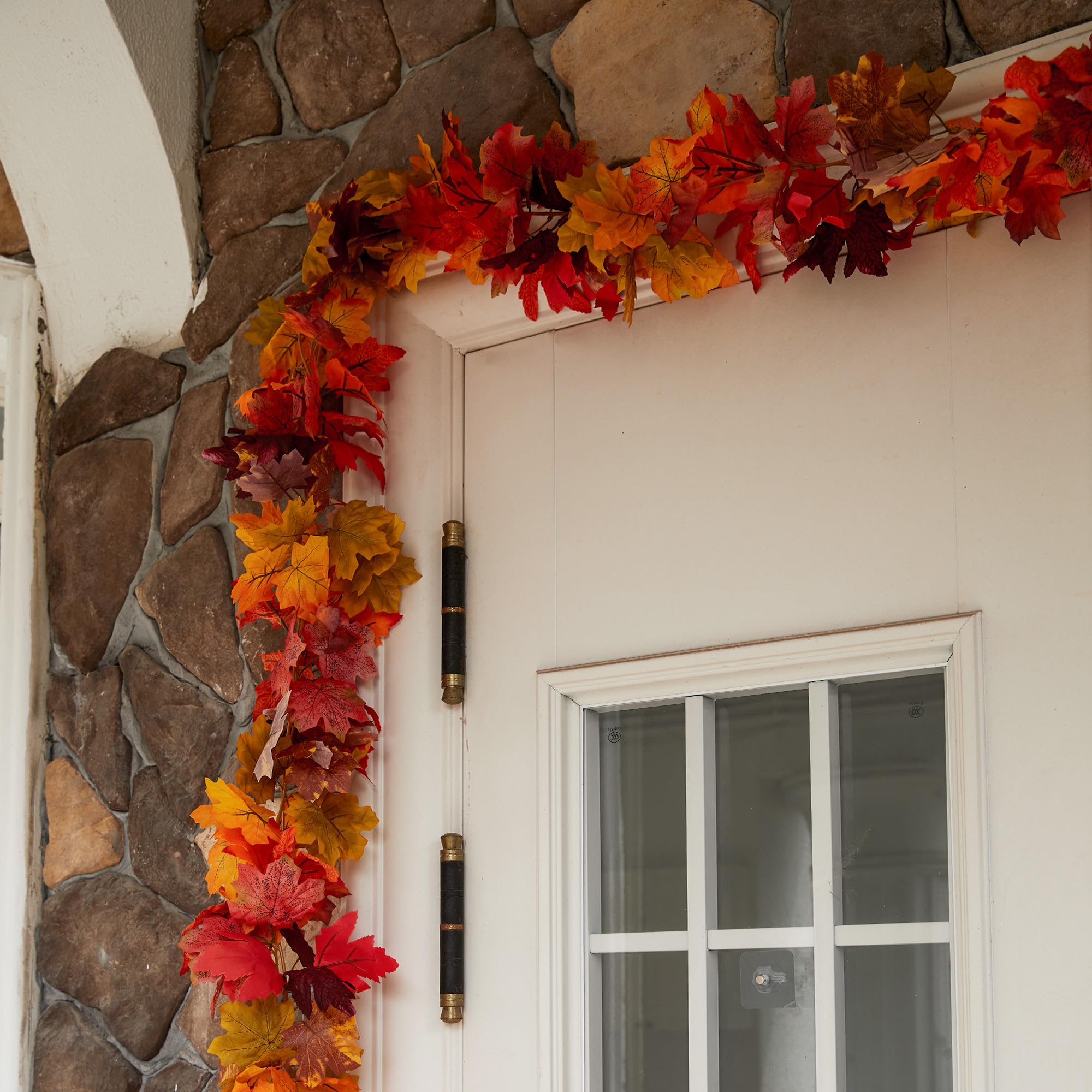 Party Joy garlands hung on covered porch illustrating outdoor staging without heavy weather exposure