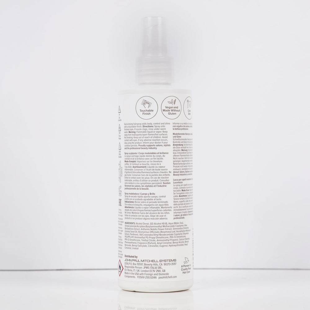 Paul Mitchell in a beauty bag beside a mirror for on-the-go restyling