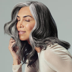 Paul Mitchell application on damp hair illustrating fuller roots and improved manageability
