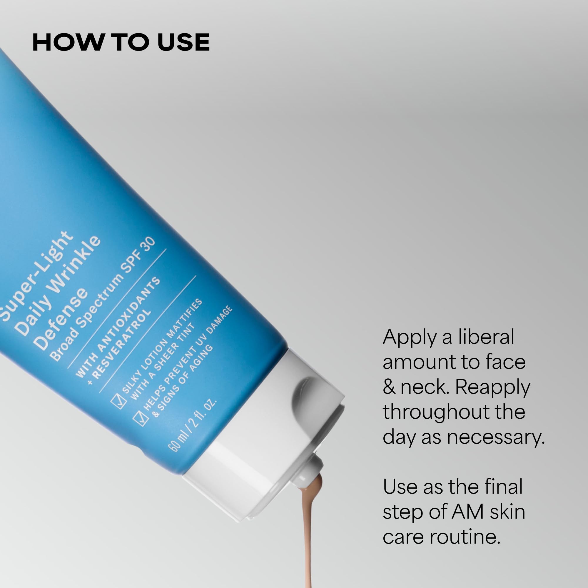 Paula's Choice applying sunscreen to hand to show blendability benefit