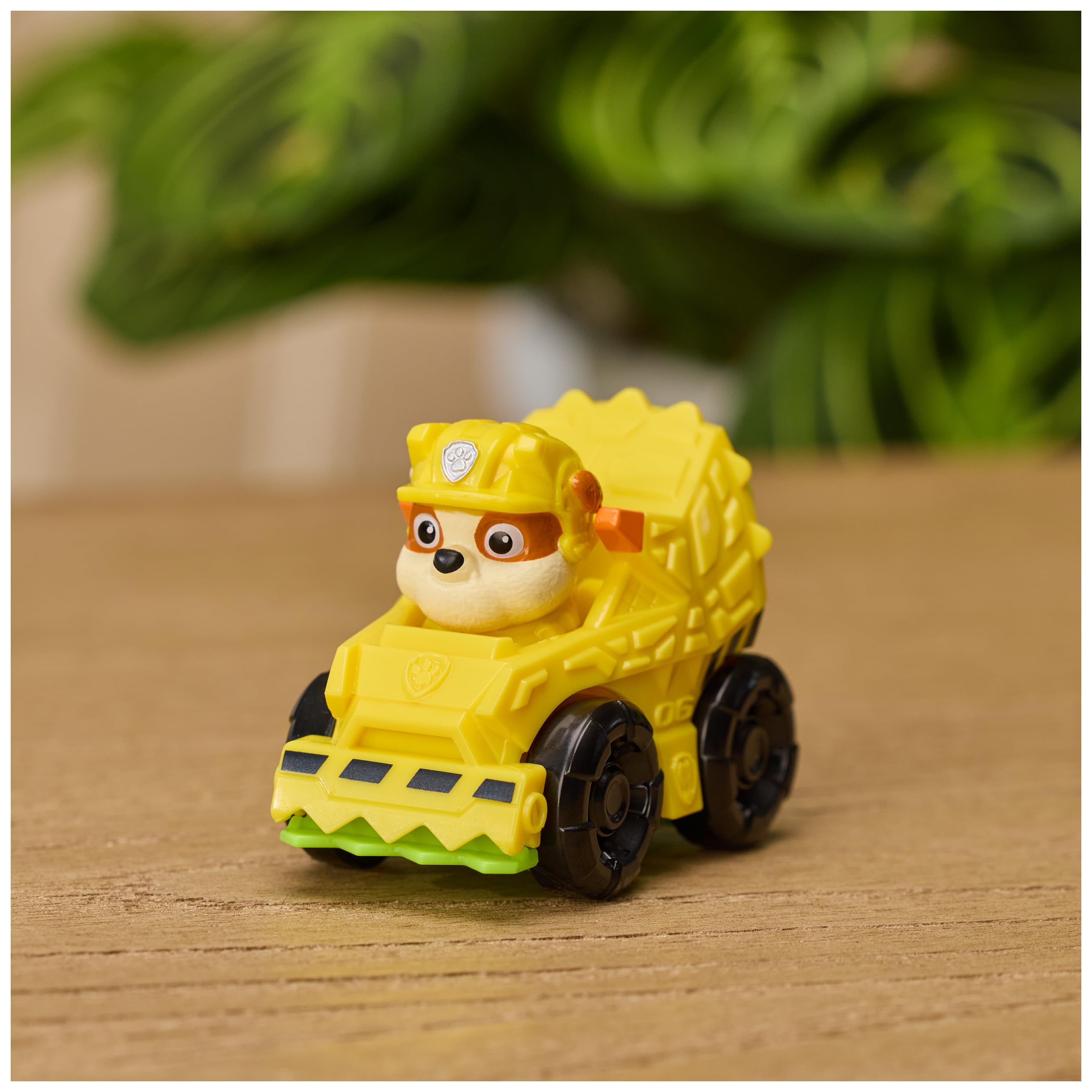 PAW Patrol racers next to Pup Squad playset for expanded adventures