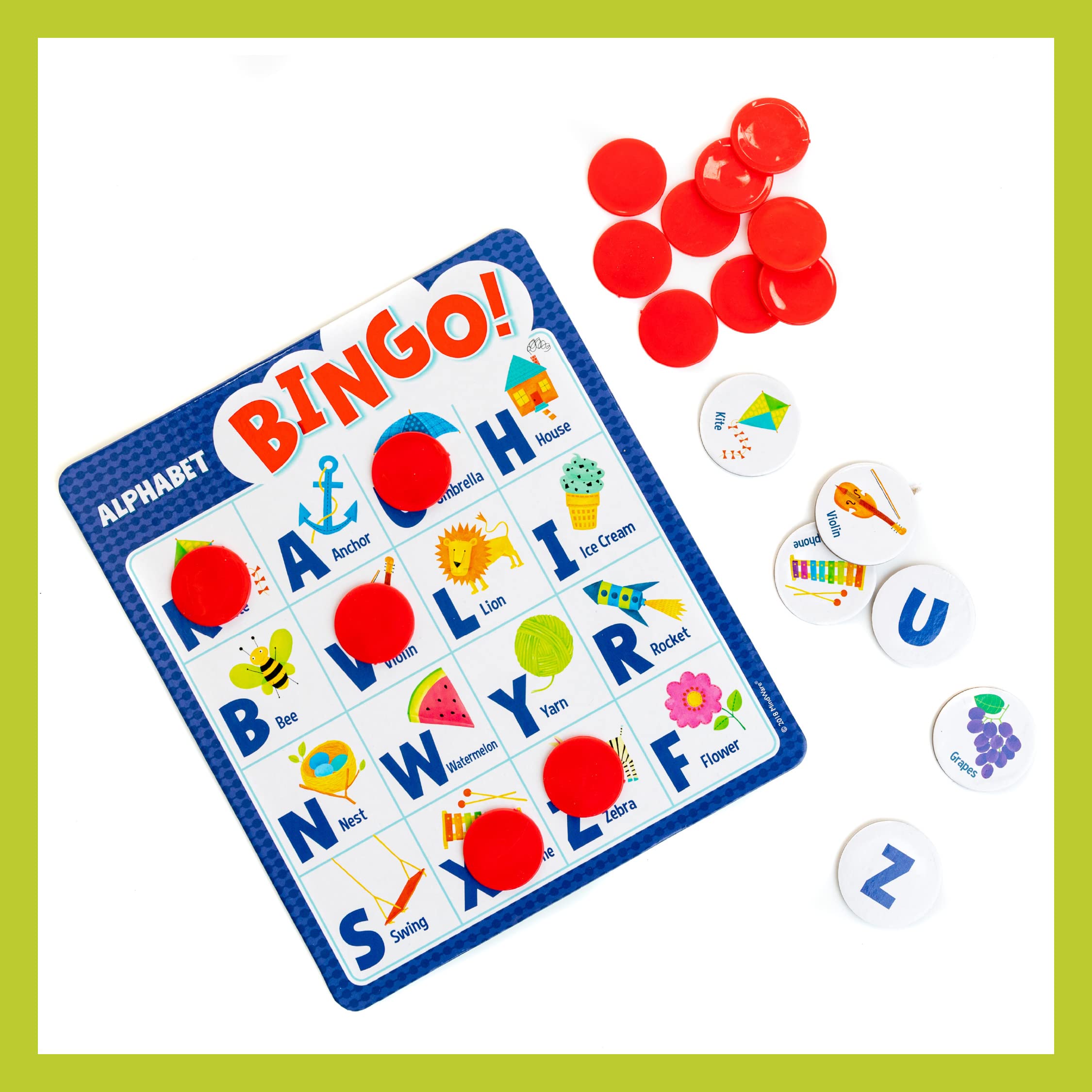 Peaceable Kingdom components next to a child’s hand showing size and kid-friendly pieces