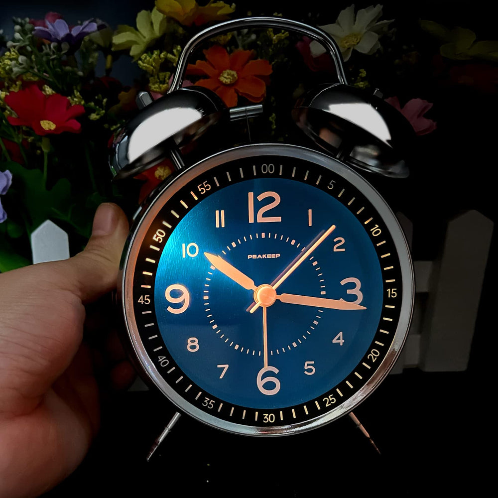 Peakeep held in hand to show compact 4-inch scale and portability benefit