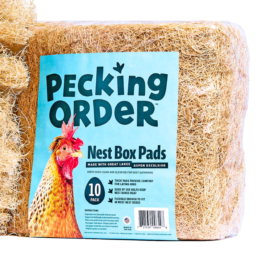Pecking Order pad placed in a nest box showing easier egg collection