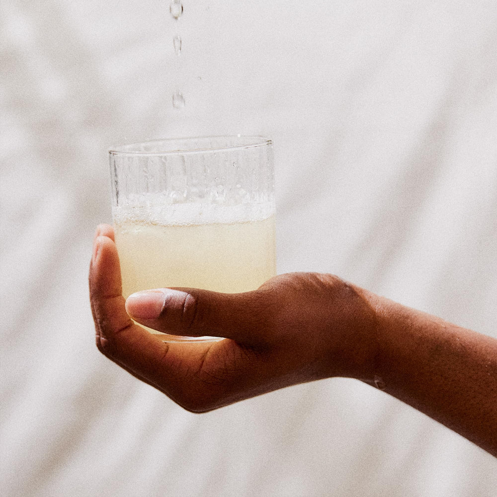 Perelel powder dissolving in a water bottle for quick hydration on the go
