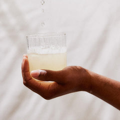 Perelel powder dissolving in a water bottle for quick hydration on the go