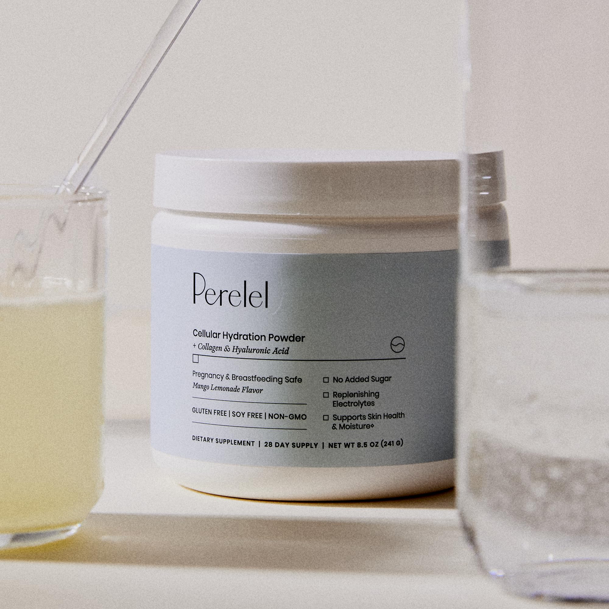 Perelel jar beside a water bottle to show scoop size and daily serving scale