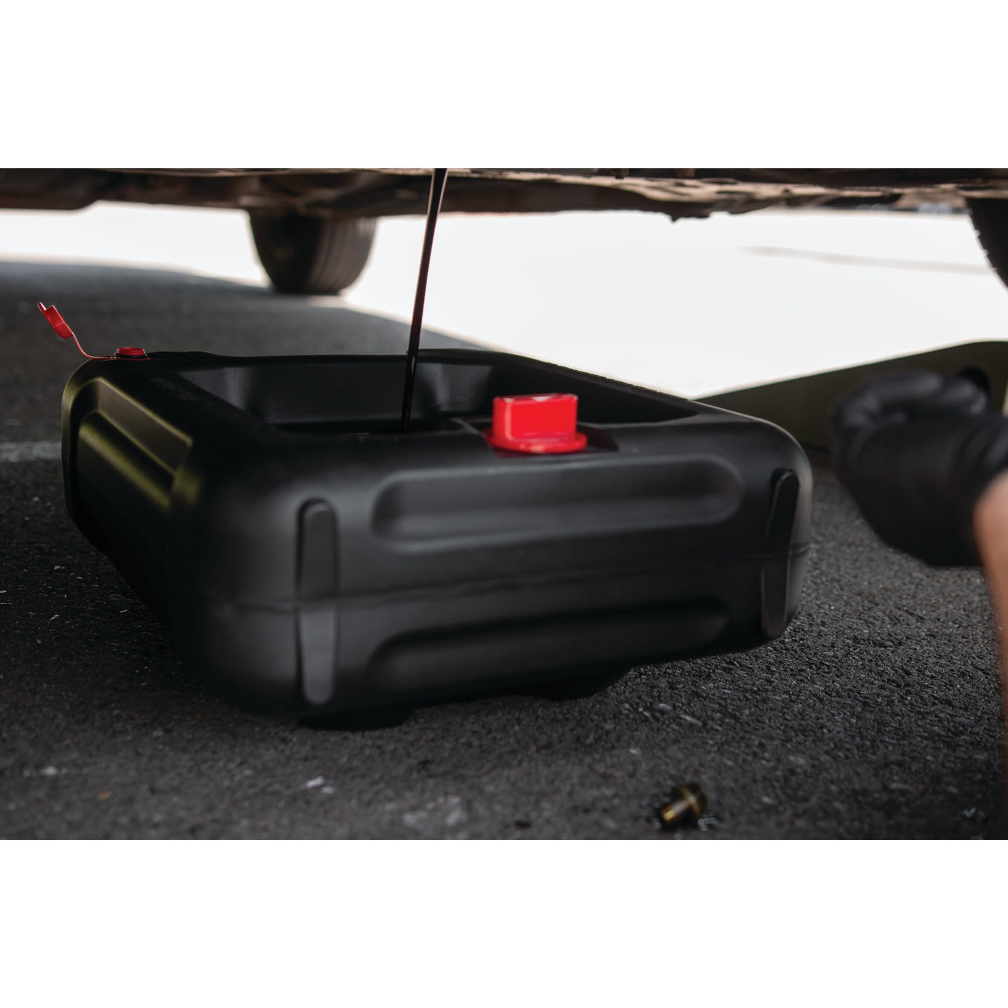 Performance Tool pouring action into recycler demonstrating spill‑free transfer