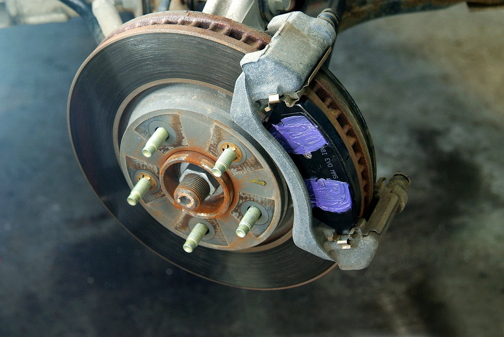 Permatex on piston and guide pin detail showing corrosion protection and smoother operation