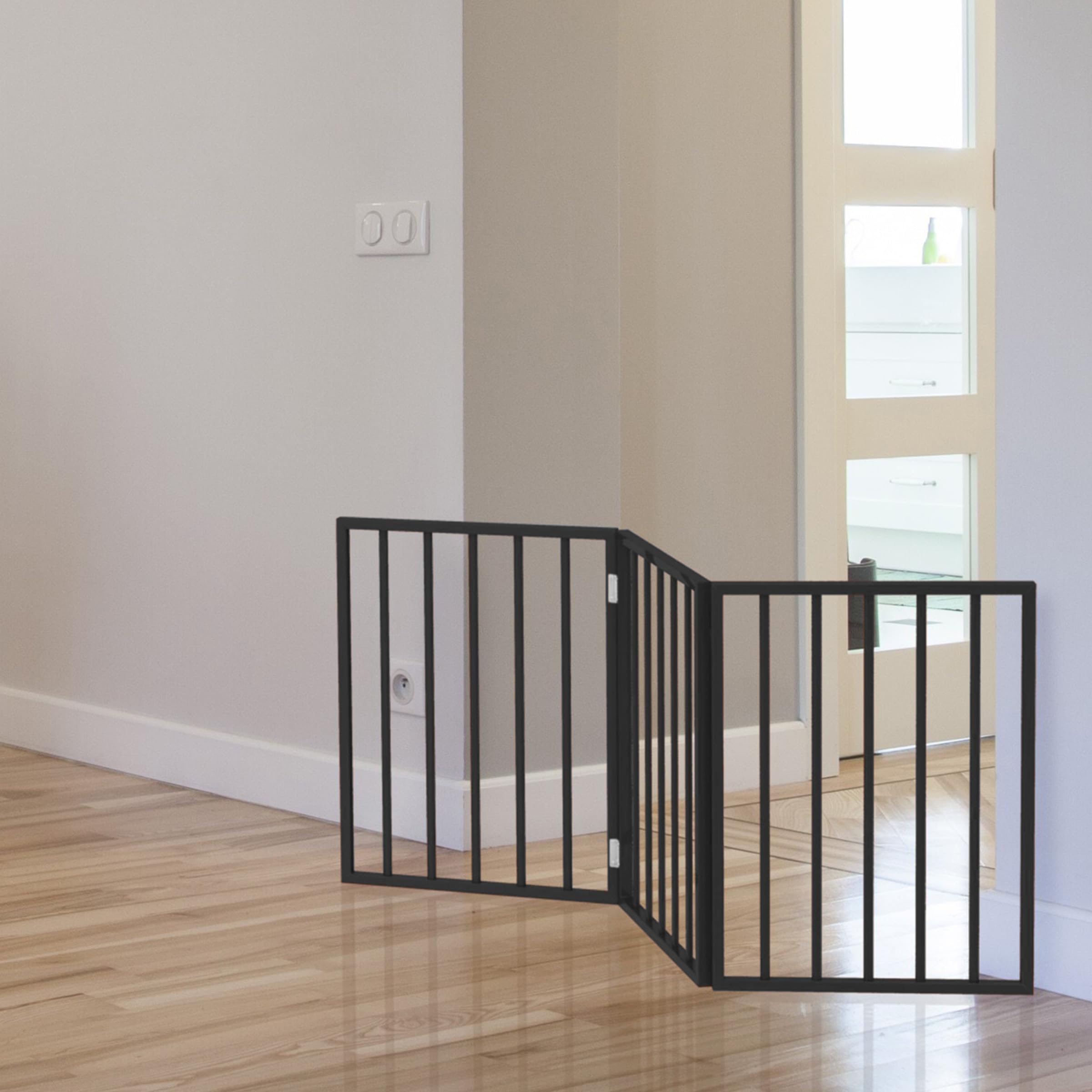 PETMAKER gate next to a hand for scale illustrating lightweight, easy handling