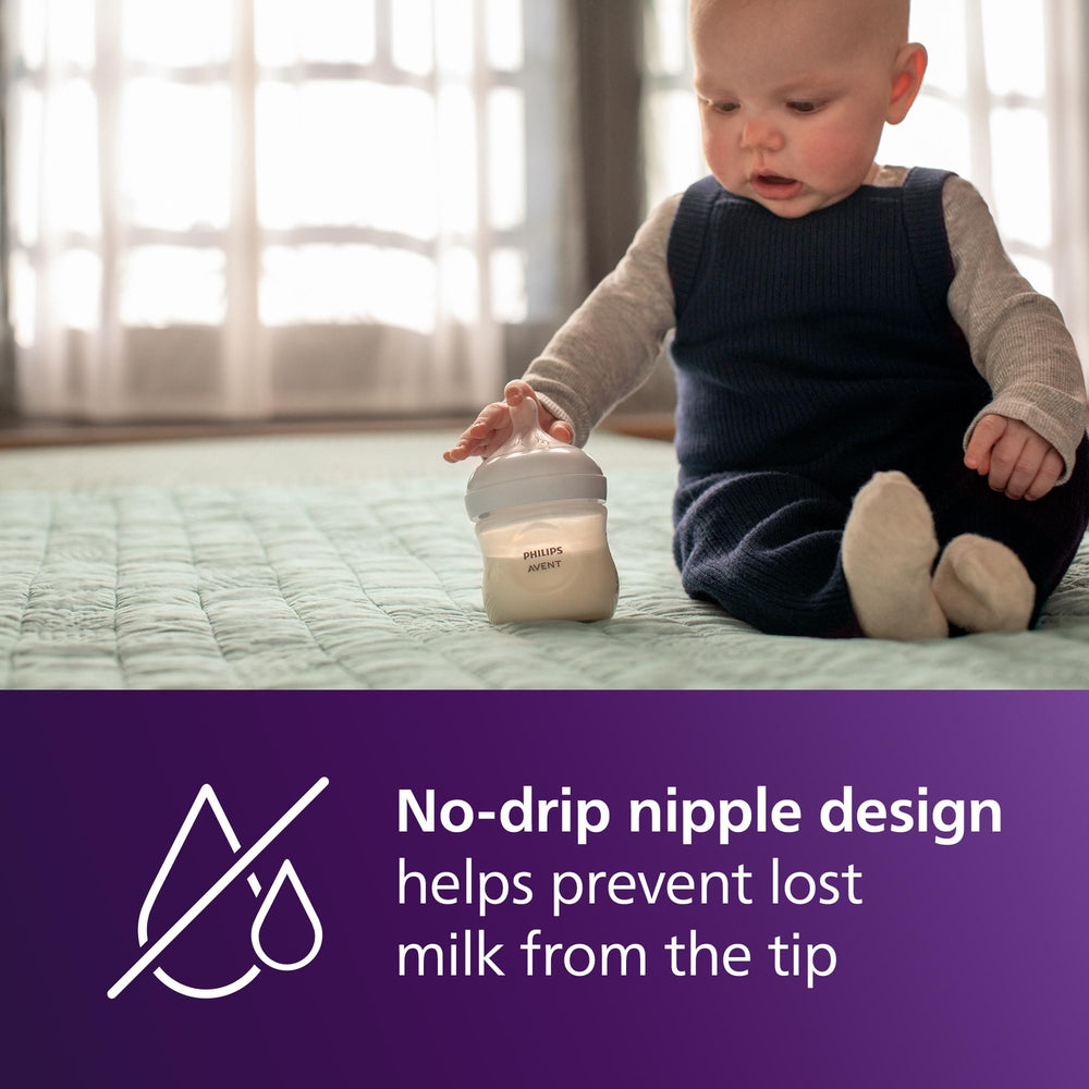Philips Avent four-bottle set arranged to show included slow nipples