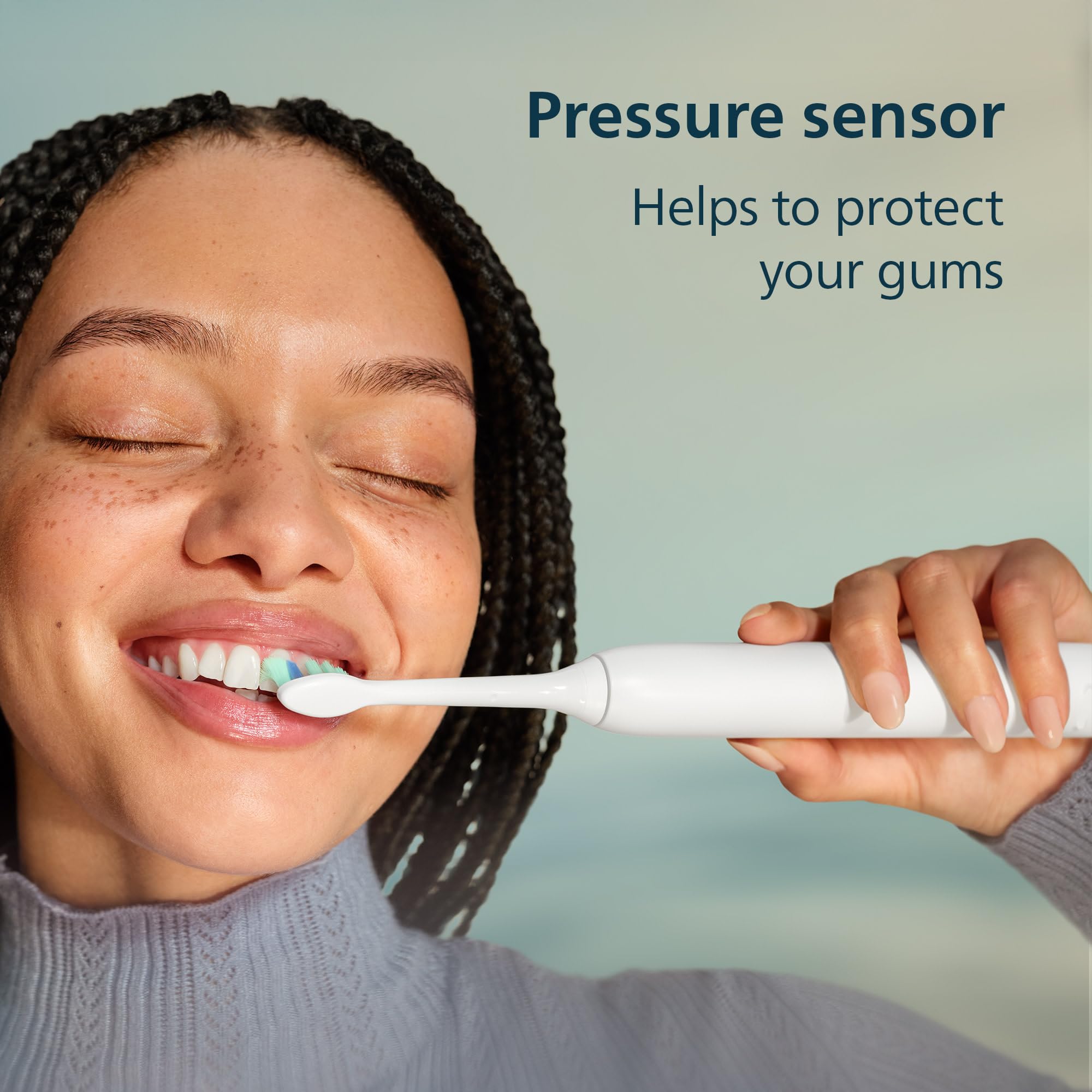 Philips Sonicare toothbrush in use on bathroom counter demonstrating effective cleaning