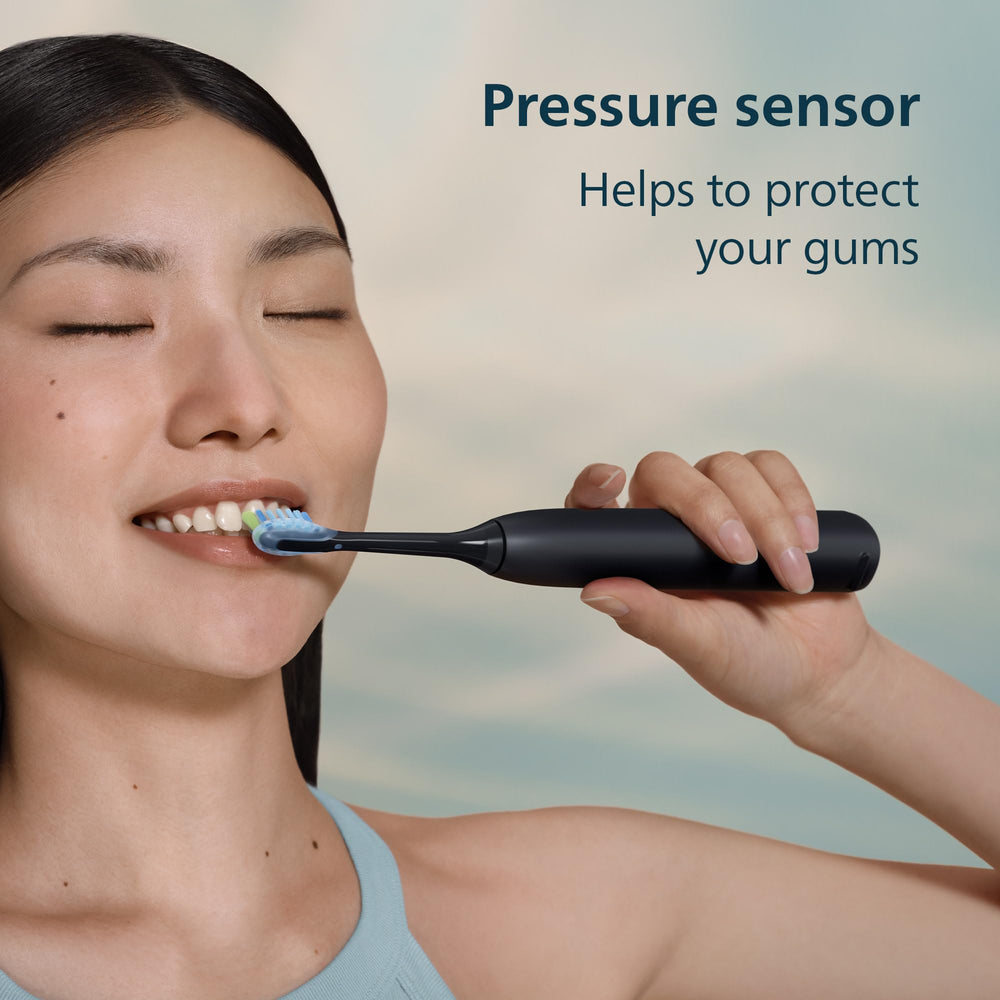 Philips Sonicare 5900 next to toothpaste to show compact size for travel