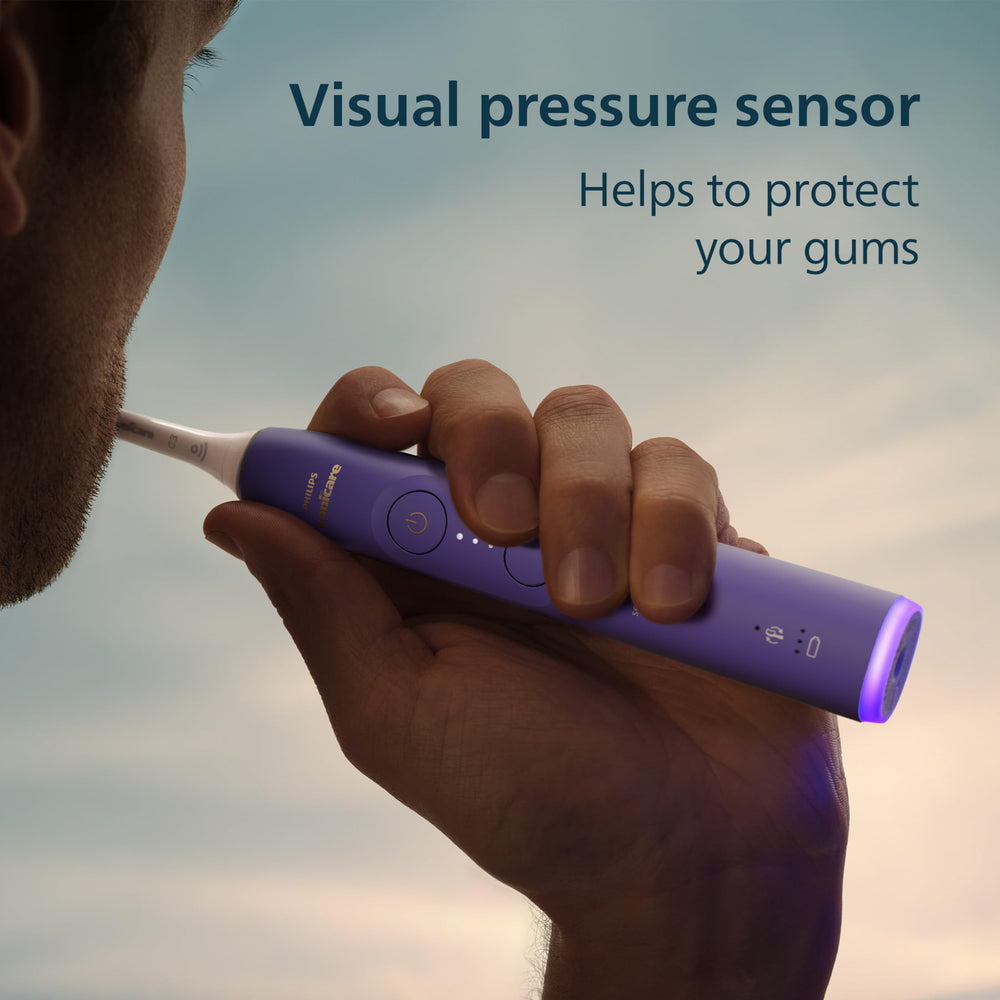 Philips Sonicare in use demonstrating gentle effective clean along gumline for improved oral care