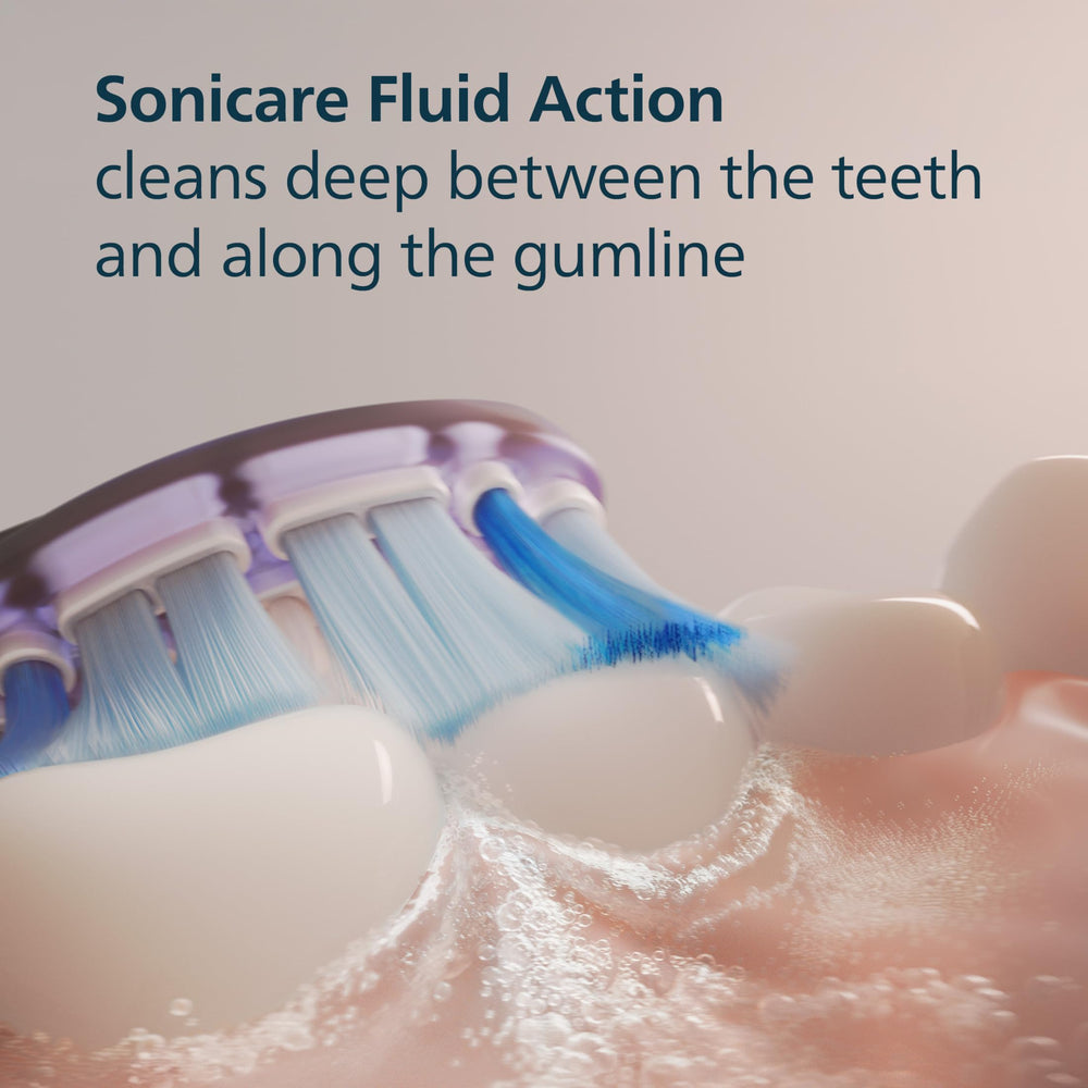 Philips Sonicare brush head held in hand showing size and scale