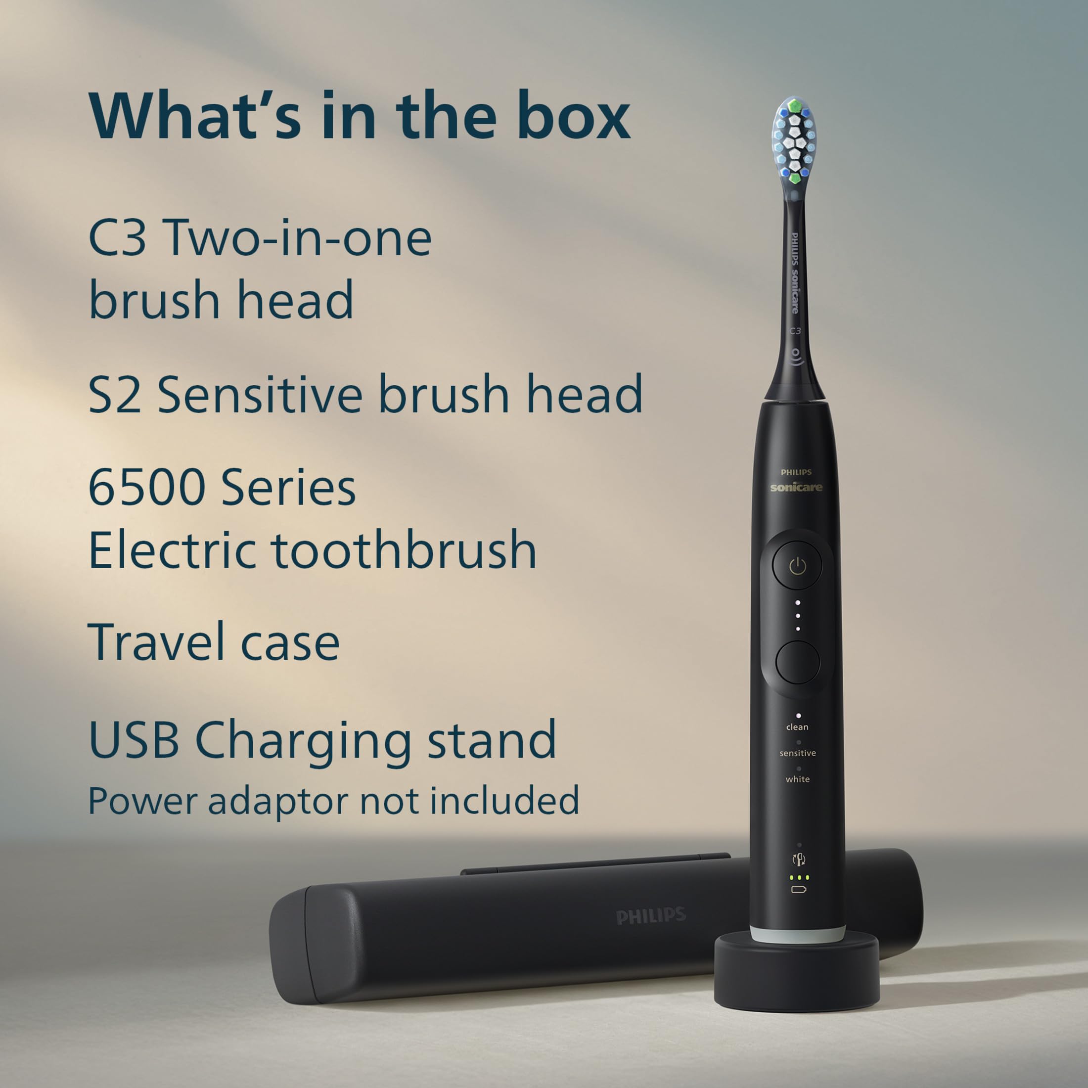 Philips Sonicare packaged contents laid out: handle, two heads, case and charging stand