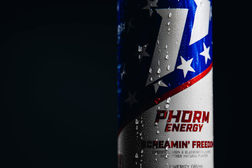 PHORM ENERGY can beside dumbbells and towel showing workout pairing benefits