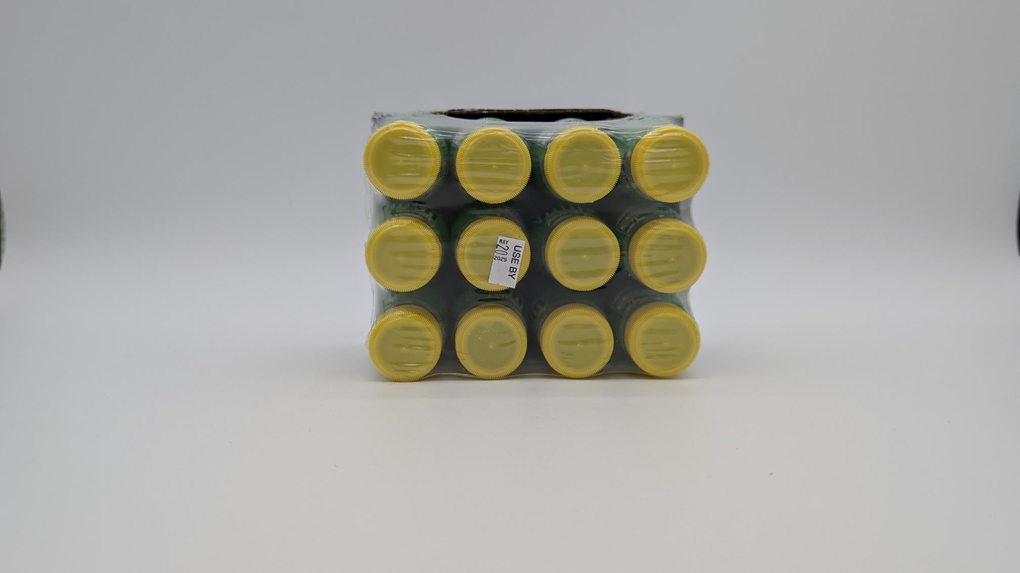 Pickle Juice bottle on bedside table illustrating nighttime cramp support