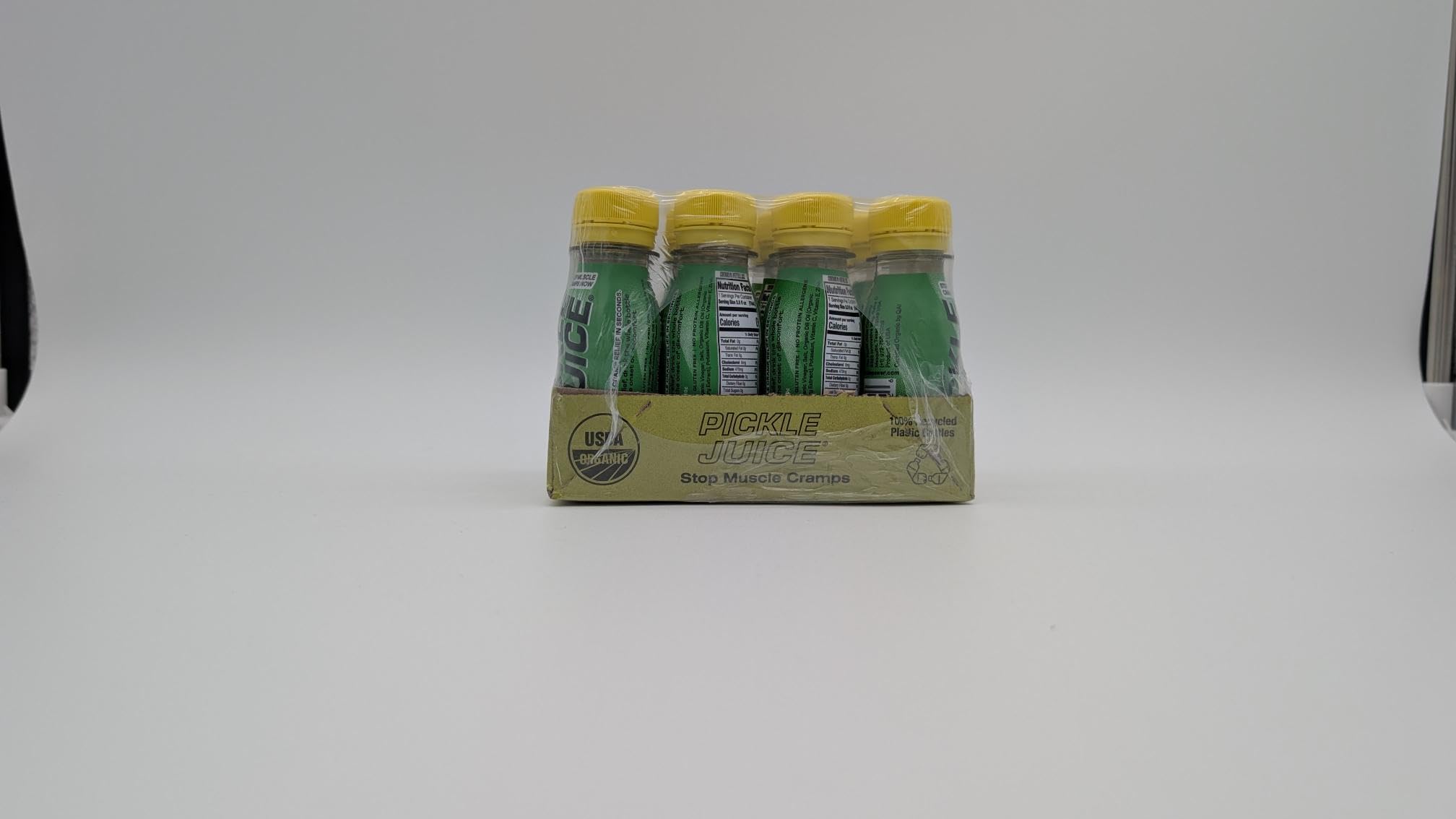 Pickle Juice bottle next to measuring scale conveying single-serve convenience