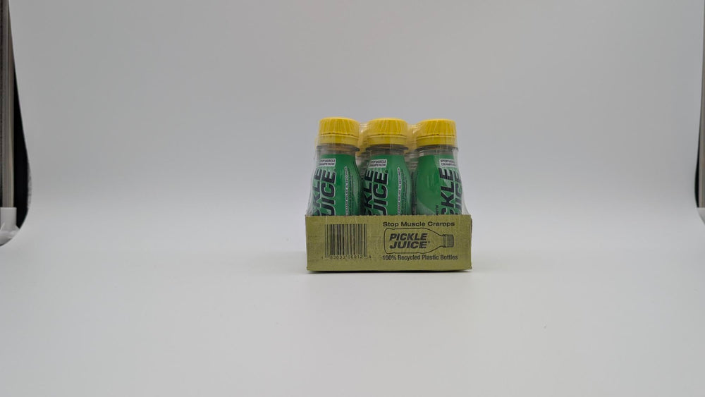 Pickle Juice shot open top pouring into hand for quick relief