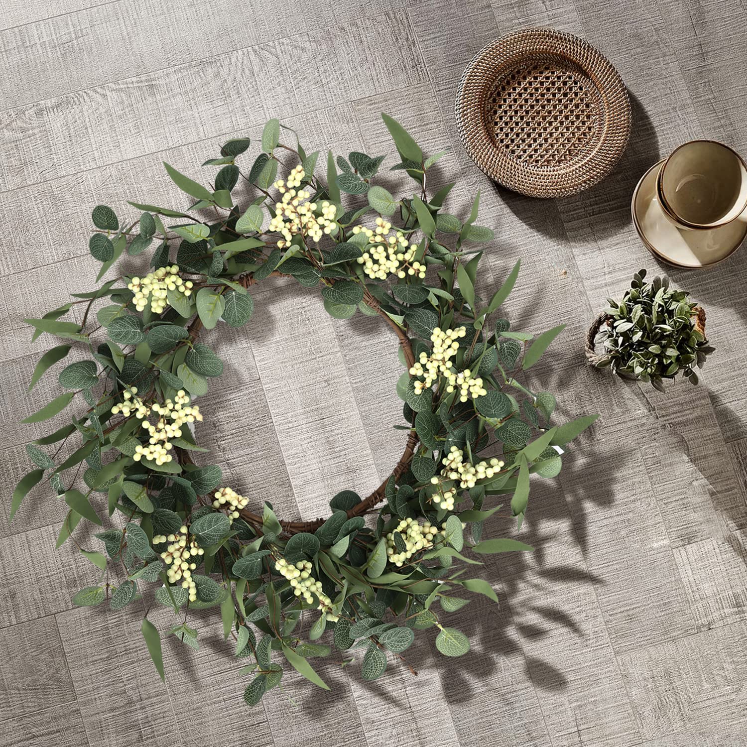 pinkpum wreath hung on a front door porch demonstrating instant entryway refresh