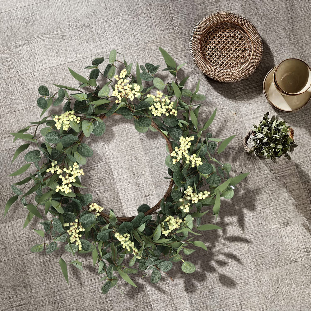 pinkpum wreath hung on a front door porch demonstrating instant entryway refresh