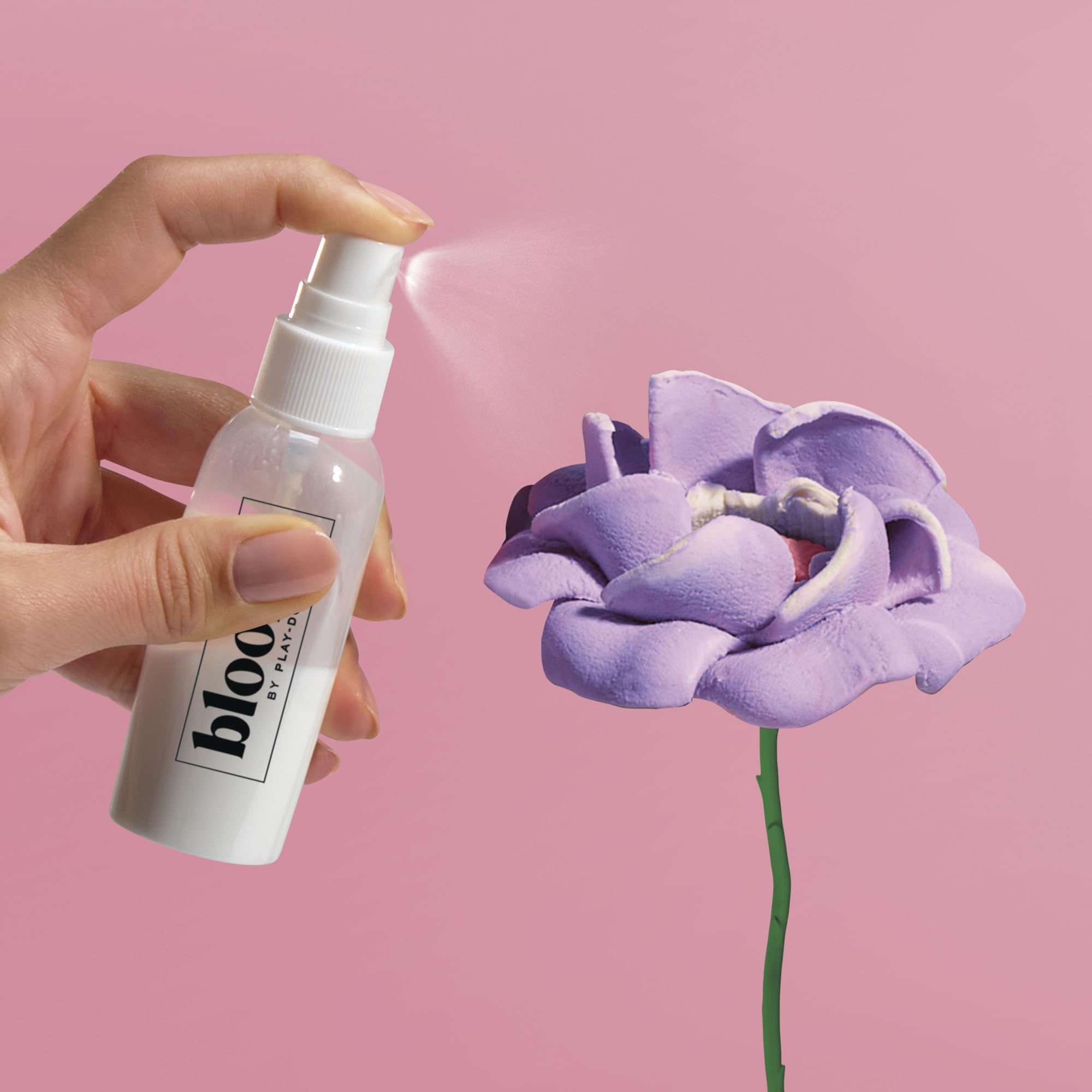 Play-Doh finishing spray being applied to protect blooms