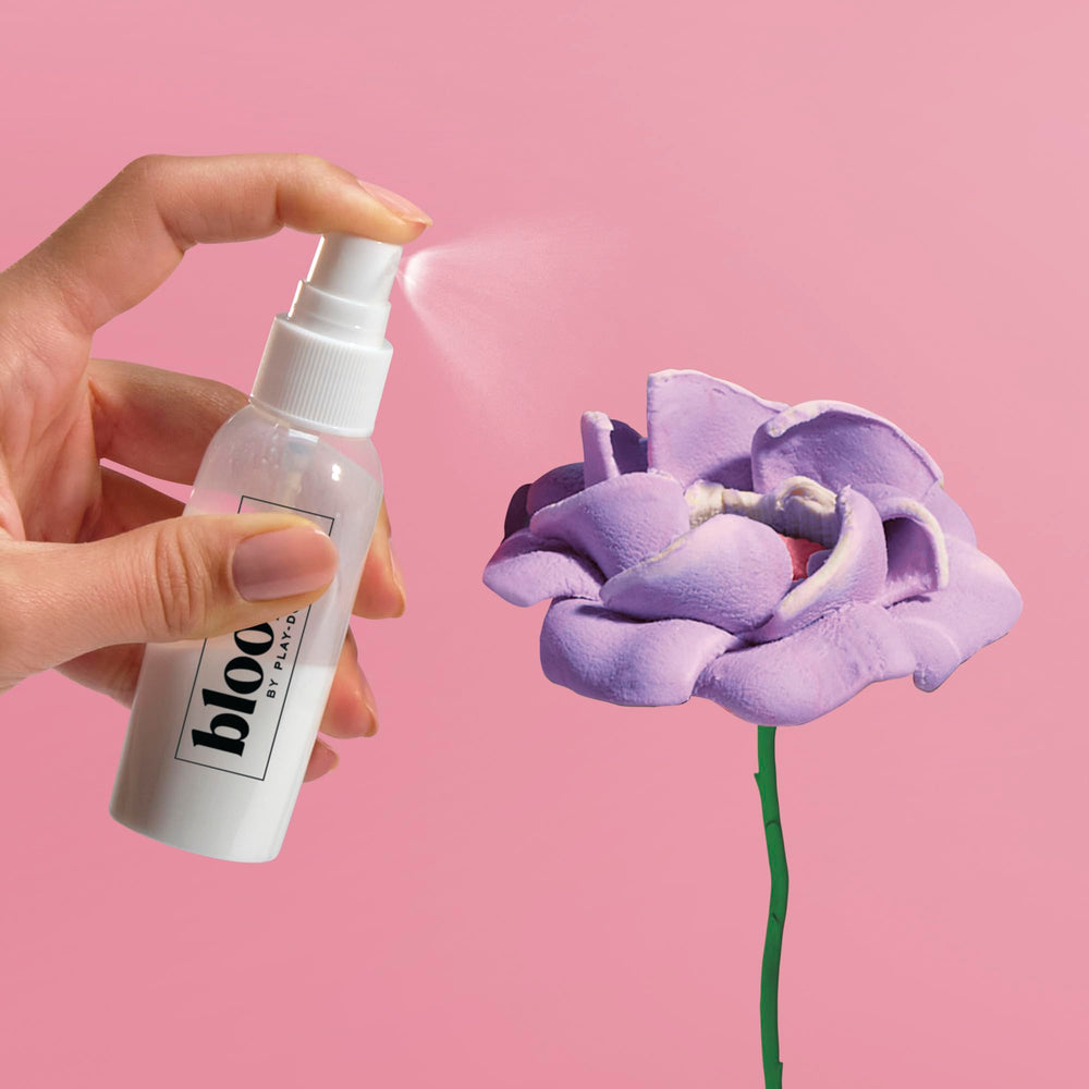 Play-Doh finishing spray being applied to protect blooms