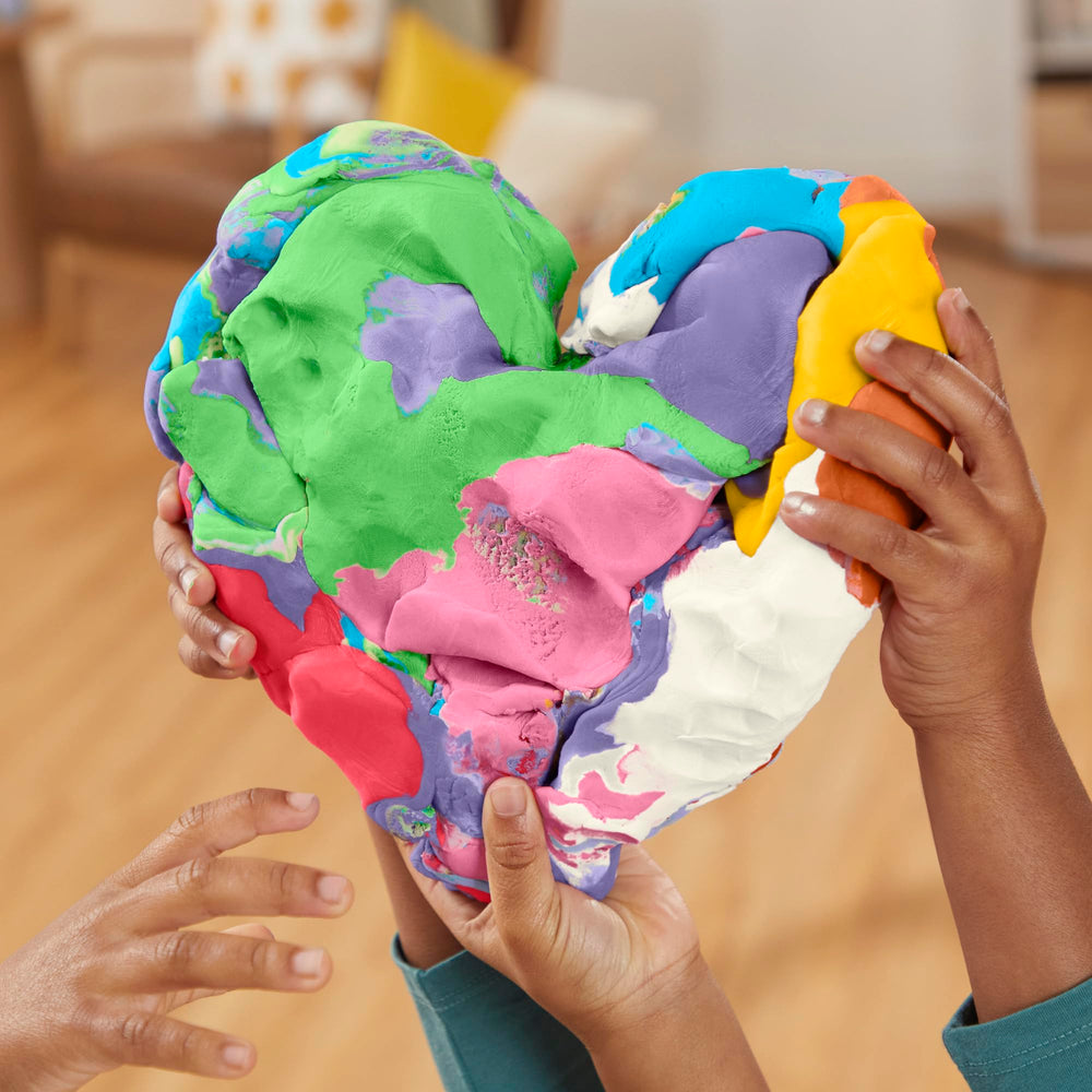 Hands shaping Play‑Doh to develop fine motor skills and creative expression