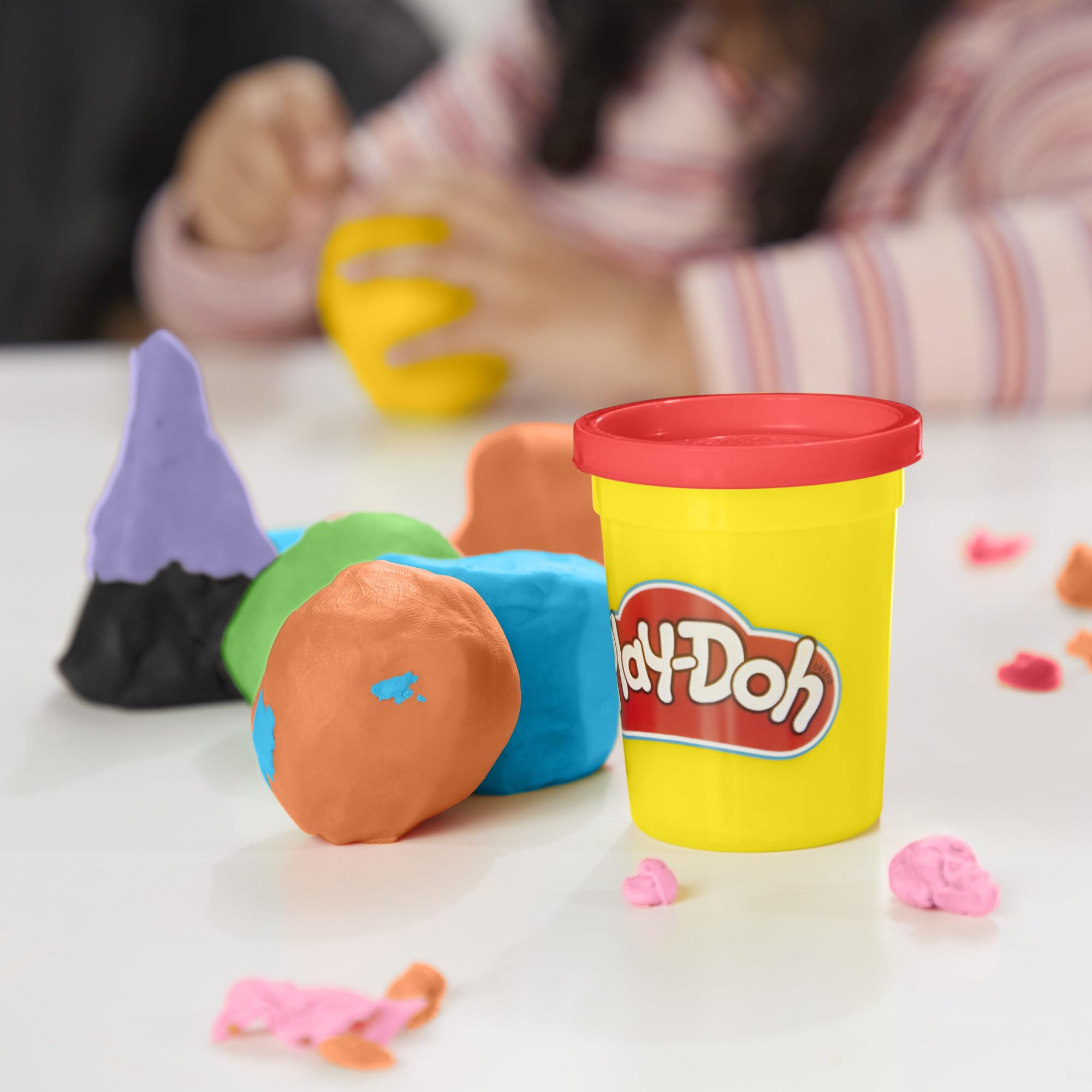 Open Play‑Doh can closeup revealing soft texture ready for molding and reuse