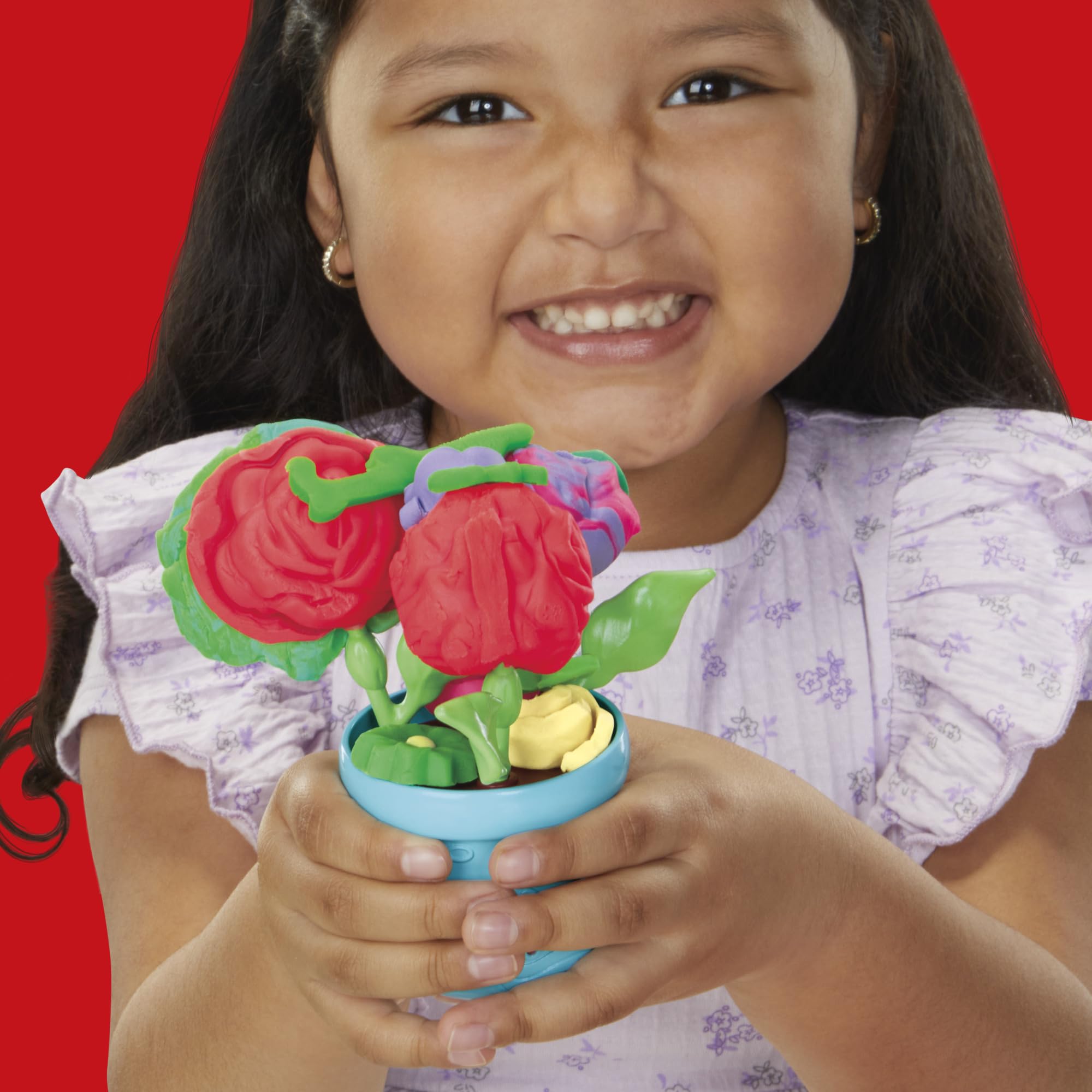 Finished blooms on stems in a vase demonstrating Play‑Doh display options