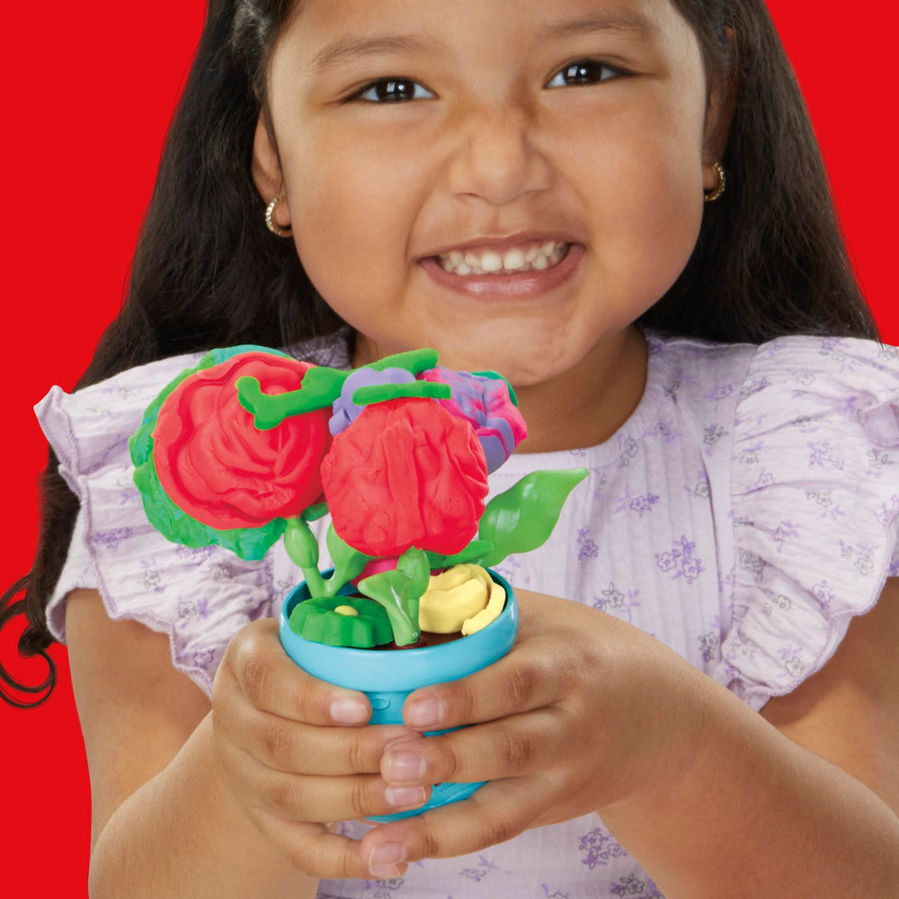 Finished blooms on stems in a vase demonstrating Play‑Doh display options