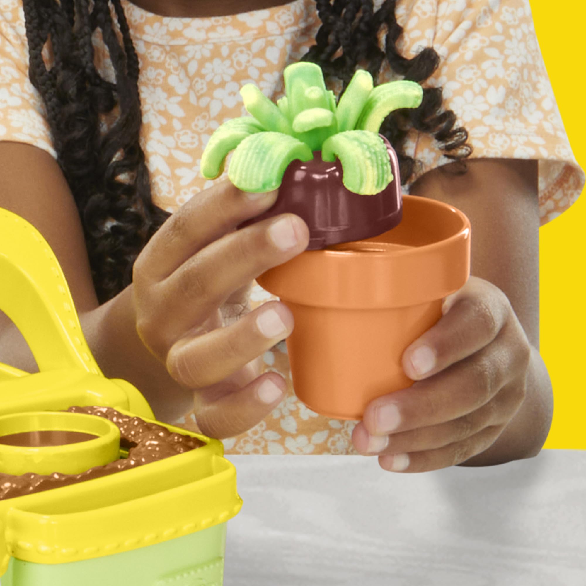 Garden box used as a carrying and storage case for Play‑Doh tools and dough
