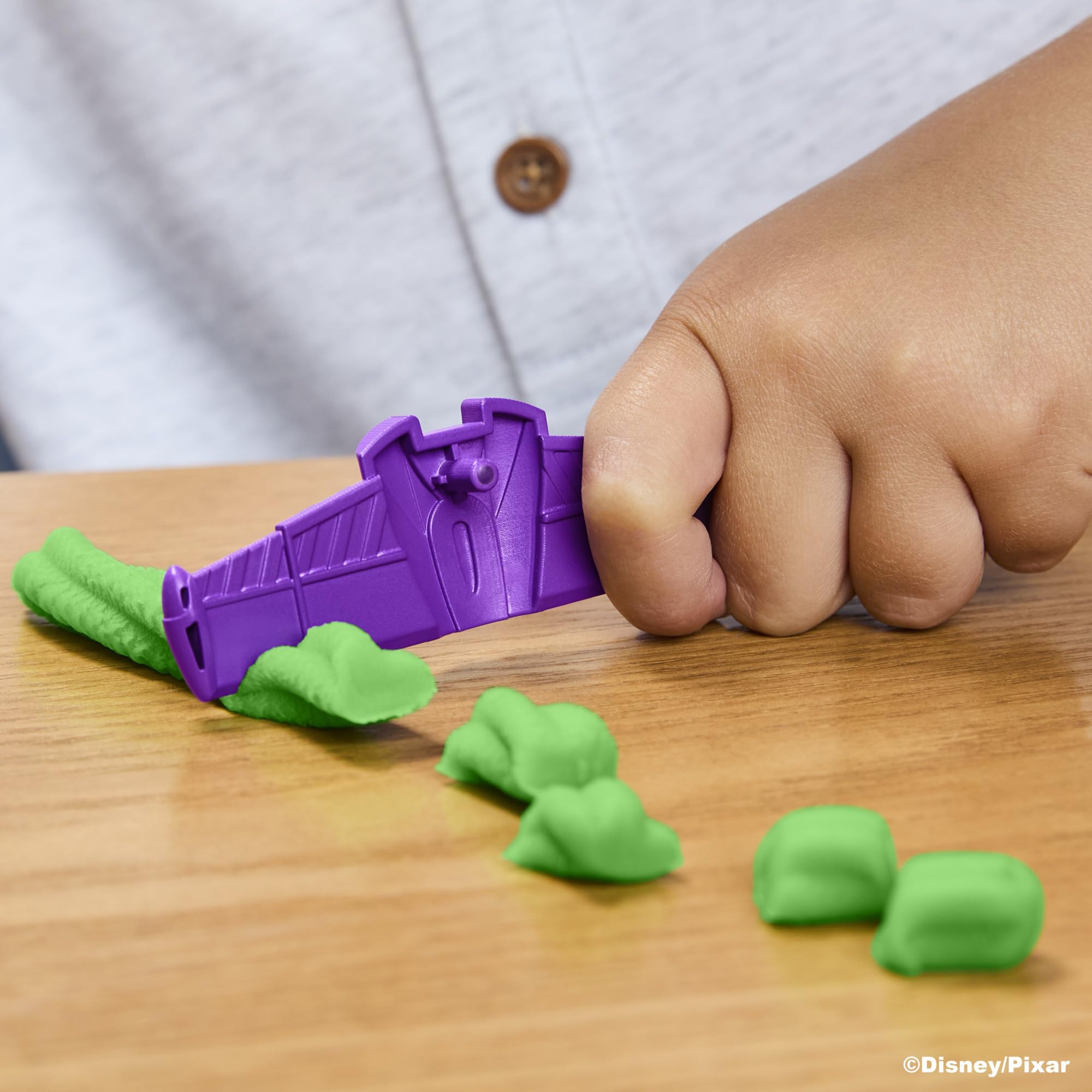 Play-Doh texture press creating faux exhaust for tactile sensory play