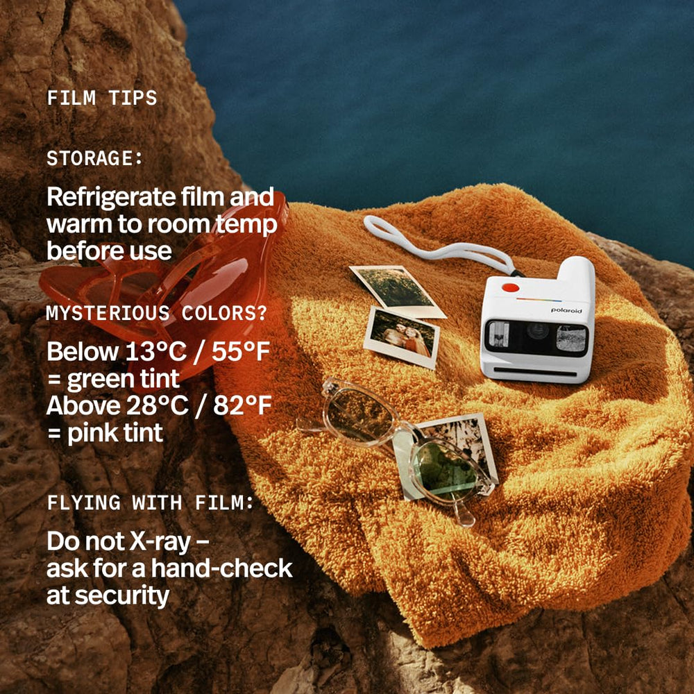 Polaroid Go film next to wristwatch showing compact size benefit