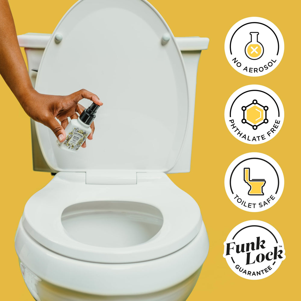 Poo-Pourri beside a toilet illustrating size and scale for portability