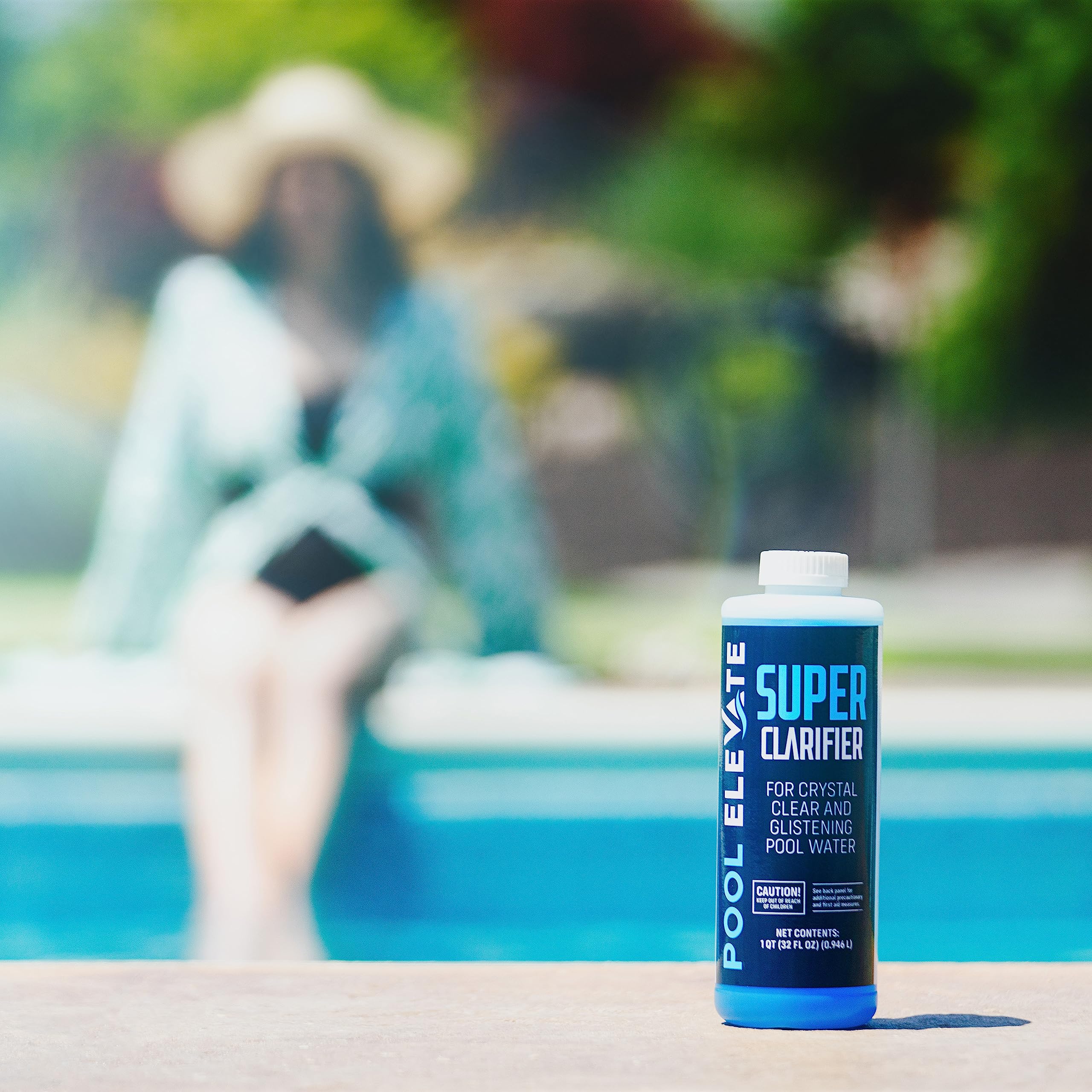 POOL ELEVATE bottle beside backyard pool illustrating sparkling water benefit