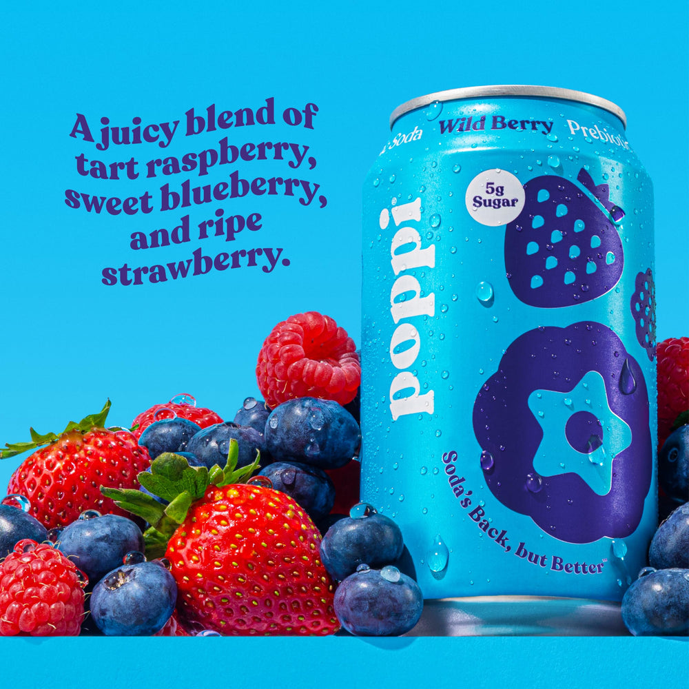 poppi Wild Berry pouring into glass with visible bubbles and foam, showing effervescent taste
