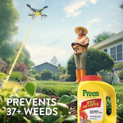 Preen granules being spread on a garden bed to prevent weeds