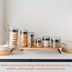 Prepara EVAK size comparison next to a measuring cup to show capacity and fit