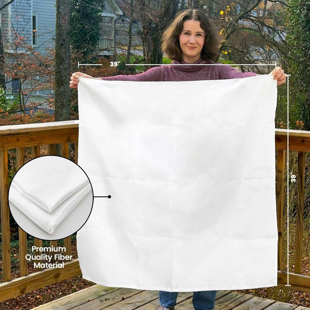 Prepared Hero blanket next to a hand showing scale and portability for home or travel